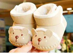 Detailed view of warm fleece lining and cute 3D bear design on baby winter boots