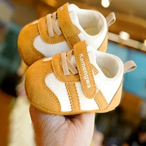 Brown and cream soft-sole baby walking shoes with velcro strap and breathable fabric