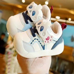 White toddler walking shoes with blue panda design and non-slip soft soles