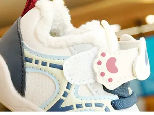 Detail shot of warm winter toddler shoes with plush lining and cute cat paw velcro strap