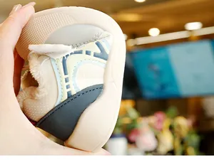 Detail shot of flexible soft sole and thick plush lining on toddlers winter walking shoes