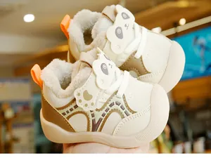 Close-up of warm faux fur lining and cute panda velcro on toddler winter shoes