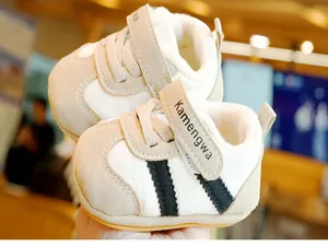 Close-up of warm plush lining and velcro closure on baby winter walking shoes