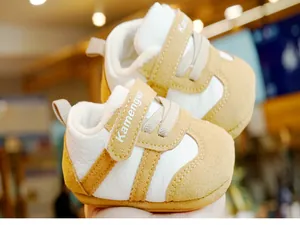 Close-up of baby winter walking shoe featuring warm fleece lining and velcro strap detail
