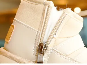 Macro detail of toddler winter boot with plush lining and metal side zipper closure