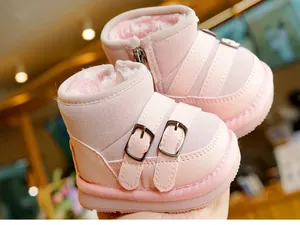 Detailed view of pink baby winter snow boots with plush lining and side buckle strap