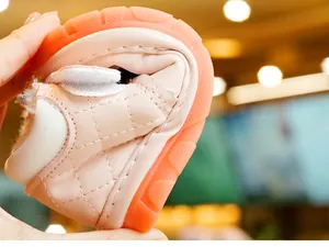 Close-up showing the extreme flexibility and soft non-slip sole of baby walking shoes