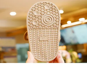Macro detail of toddler snow boot rubber sole with anti-slip texture and size 17 mark