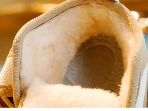 Close-up of thick white faux wool lining inside toddlers winter snow boots for warmth