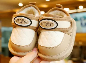 Detailed macro view of the thick plush lining and anti-slip sole on baby winter snow boots
