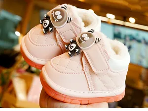 Detail of pink winter baby walker shoe with warm plush lining and non-slip rubber sole