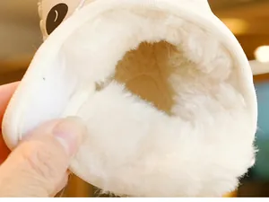 Close-up of thick plush faux fur lining inside warm winter baby shoes for newborns