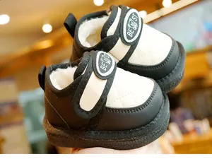 Detail of warm winter baby boots featuring diamond quilting and plush fleece lining
