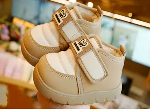 Close-up of warm winter toddler boots with plush lining and velcro strap design