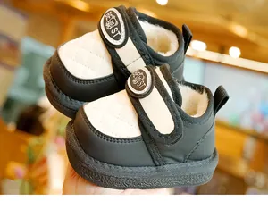 Detail of warm winter baby boots with plush lining and quilted leather finish