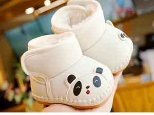 Close-up of baby winter boots with warm plush lining and cute panda cartoon design