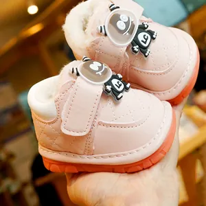 Pink quilted baby winter boots with warm faux fur lining and non-slip rubber soles