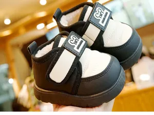 Detail of warm winter baby boots with white faux shearling lining and Velcro strap