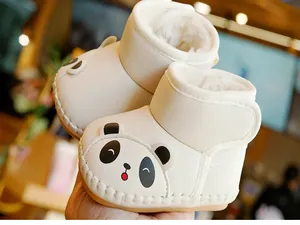 Close-up of baby panda boots with thick faux fur lining and velcro strap detail