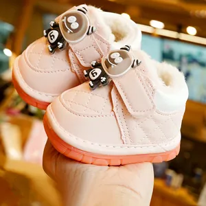 Pink fleece-lined baby walking shoes with quilted PU leather and cute monster velcro strap