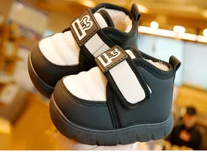 Detailed close-up of winter baby snow boots with fleece lining and velcro closure
