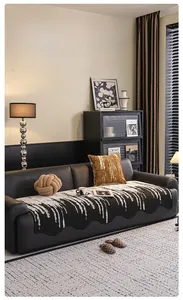Detail of chenille sofa cover showing wavy edges and black and white splash ink texture