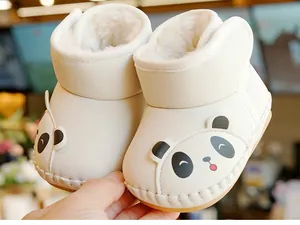 Detail of baby winter shoes with panda design and warm fleece lining