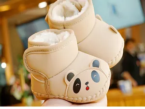 Detail of warm baby snow boots with cute panda pattern and thick fleece lining