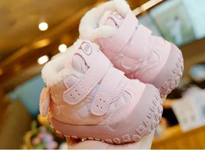 Detail of pink quilted baby snow boots with thick plush lining and anti-slip rubber soles