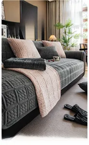 Close-up of thick milk velvet quilted sofa cushion with geometric texture and plush fabric