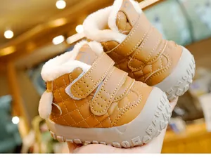 Detail of warm winter baby boots with faux shearling lining and double velcro straps