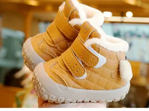 Detail of warm winter baby boots with faux fur lining and double hook-and-loop straps