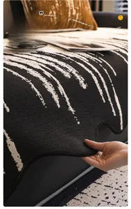Close-up of chenille sofa cushion featuring irregular wavy edges and black striped pattern