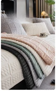 Close-up of thick milk velvet sofa cushions with textured diamond and cable knit patterns