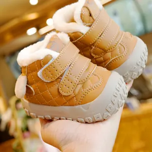 Quilted tan baby winter boots with warm fleece lining and non-slip rubber soles