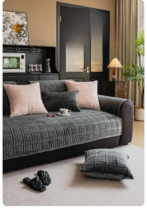 Detail of grey quilted milk fleece sofa cover featuring thick 3D square embossed texture