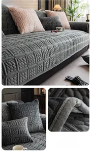 Macro shot of dark grey milk velvet sofa cover with square quilted texture and thick fabric