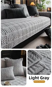 Macro detail of plush light gray sofa cover with thick 3D geometric embossed texture