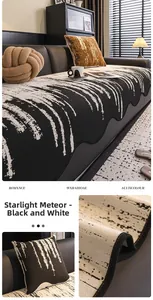 Detail of chenille sofa mat featuring black and white starlight meteor pattern and wavy edges