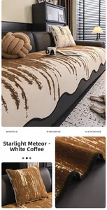Detail of chenille sofa cover with wavy edge in white and coffee meteor pattern