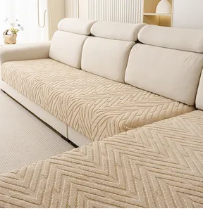 Détail macro du coussin de canapé beige avec tissage jacquard à chevrons texturé