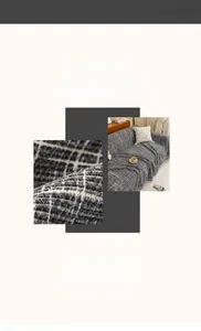 Macro detail of dark grey textured waffle weave fabric and minimalist living room scene