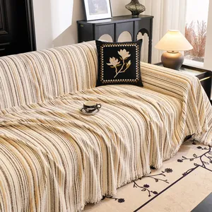 Minimalist striped sofa throw cover with tassels and embroidered floral cushion