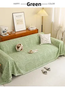 Close-up of green textured tweed sofa cover with elegant short tassel edge detail