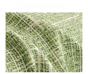 Detailed macro shot of premium woven green tweed fabric for luxury sofa protection cover