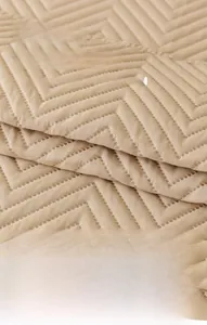 Close-up of quilted five-layer waterproof sofa cover fabric with non-slip zigzag texture