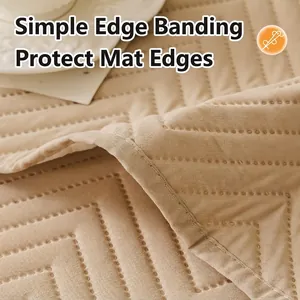 Modern quilted sofa protector in beige with geometric stitching and durable edges