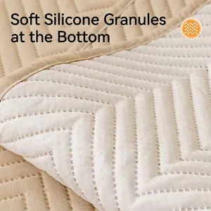 Quilted non-slip sofa cover with waterproof fabric and silicone anti-skid backing