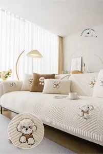 Close-up of fluffy cream sofa cover featuring 3D cartoon dog embroidery details