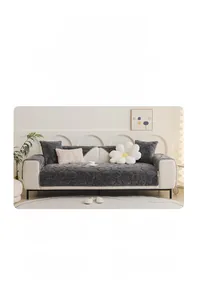 Detail of dark grey plush sofa cover with stone pattern embossing and thick texture